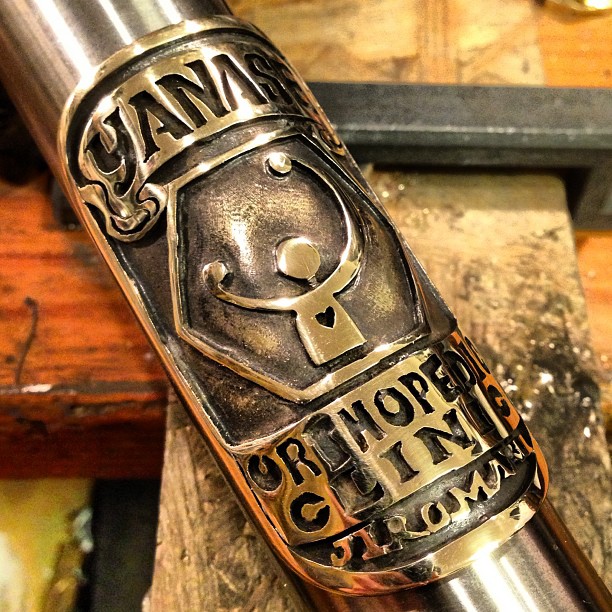 hospital logo motif bicycle head badge emblem by Rui & Aguri Fine Jewelry